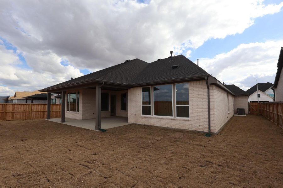 Exterior details and patio area of a home in Dunham Pointe, Cypress (Image 20).