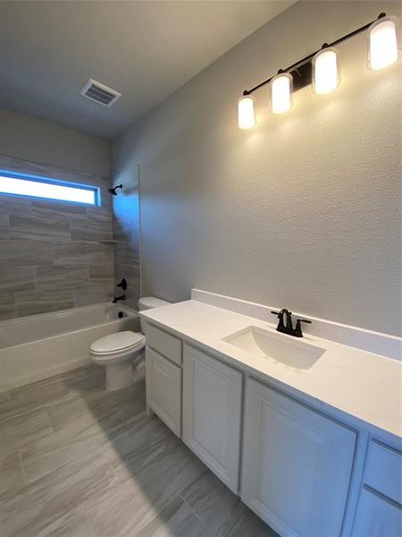 Bath 2 downstairs with window for natural light, quartz counters & 12x24 tile (mirror not intalled yet)