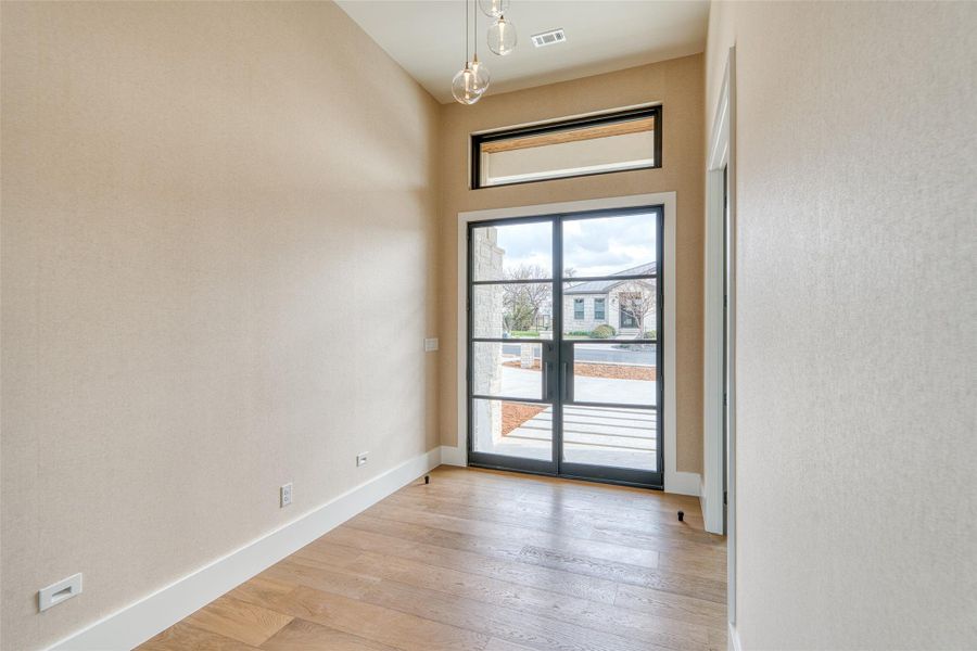 Custom double eight-foot steel doors welcome you home