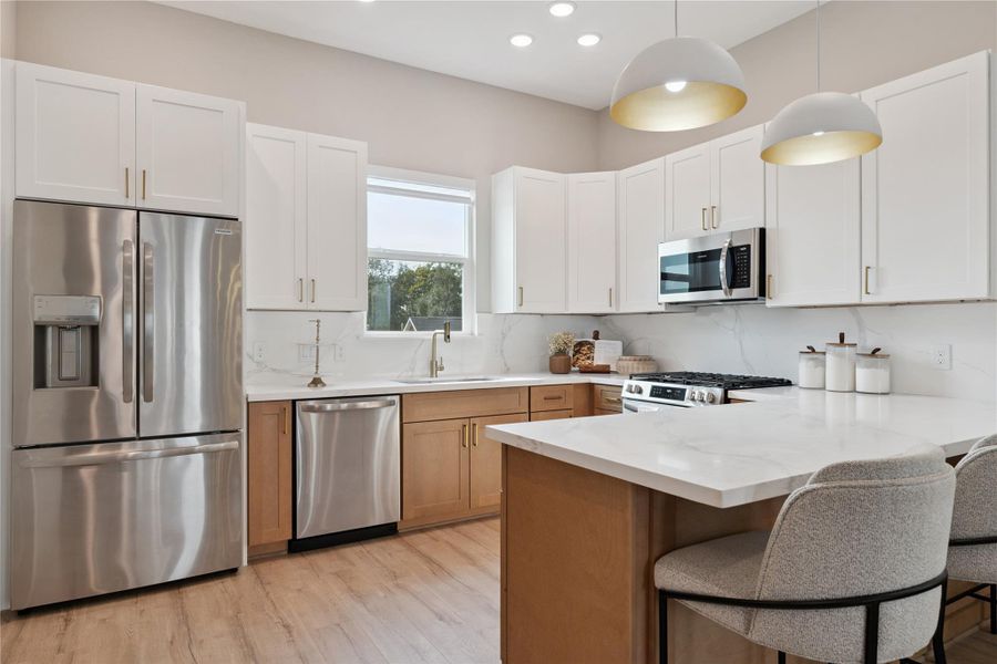 Crafted with architectural discipline, the kitchen is a quiet showcase of natural textures and thoughtful spacing.