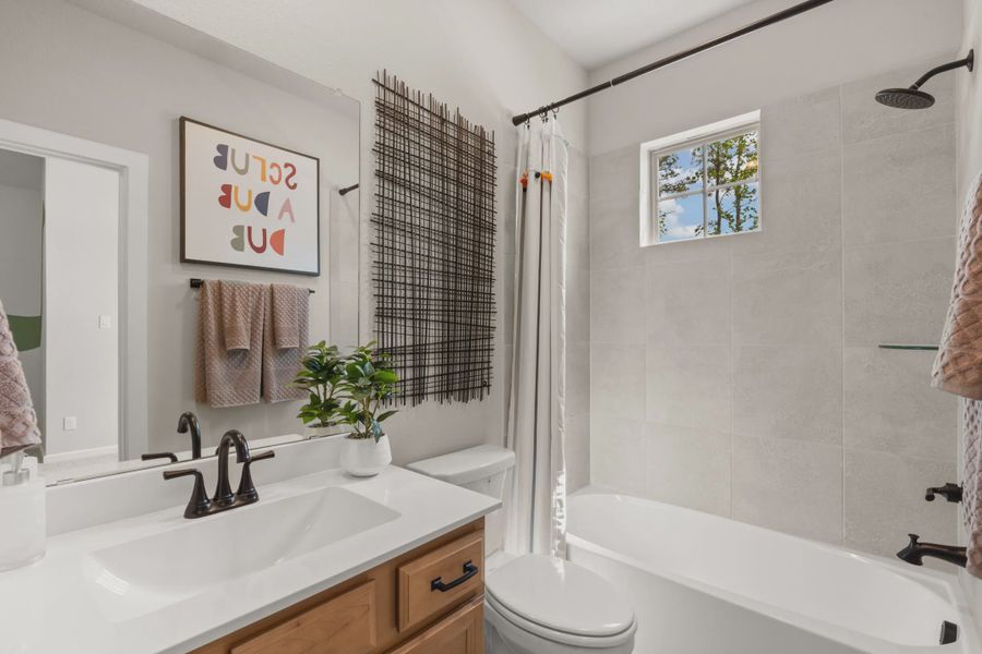 Representative furnished interior of a home built from the Chantilly by Chesmar Homes in The Woodland Hills Chateau, Willis (Image 12).