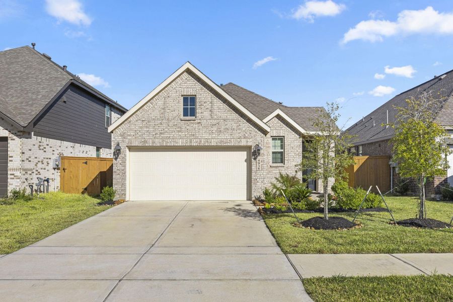 Front exterior of a new home in Sunterra: Avante Collection, Katy, TX, highlighting curb appeal (Image 2).