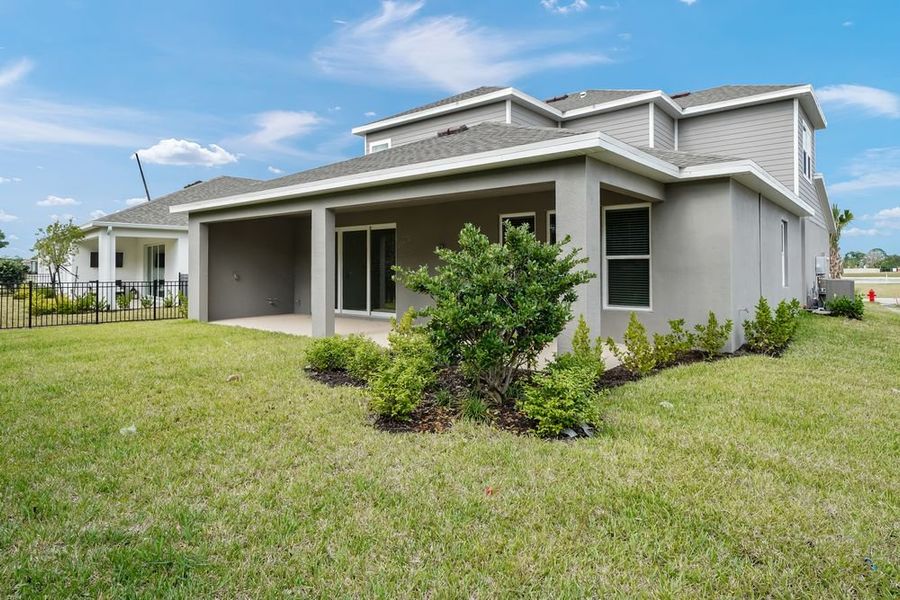 Exterior details and patio area of a home in Veranda Oaks, Port St. Lucie (Image 4).