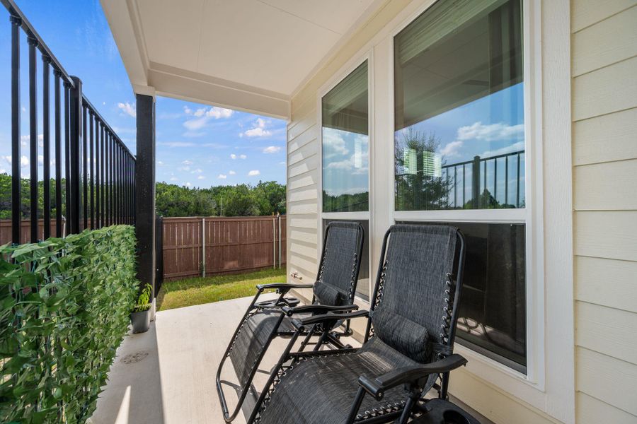 Exterior details and patio area of a home in Messinger Village, Austin (Image 25).