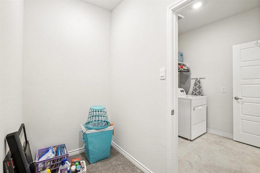 Laundry room featuring baseboards Laundry room featuring baseboards