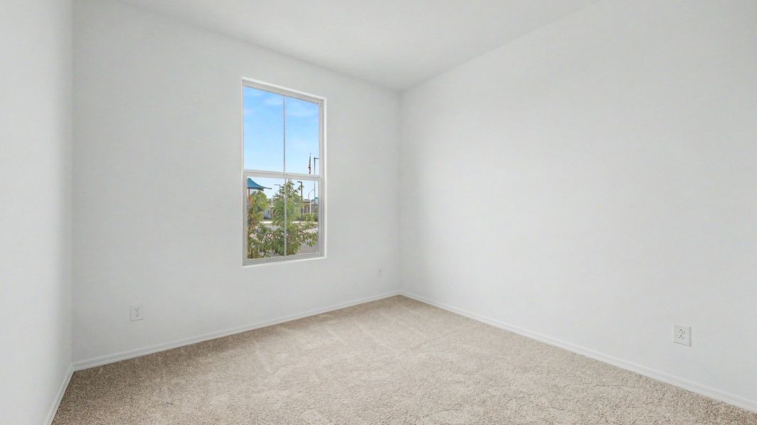 Second bedroom view 1 in move-in ready single-story Clover by DRB Homes at Sienna Park, 1315 S. 215th Dr., Buckeye, AZ 85326. Second bedroom view 1 in move-in ready single-story Clover by DRB Homes at Sienna Park, 1315 S. 215th Dr., Buckeye, AZ 85326.