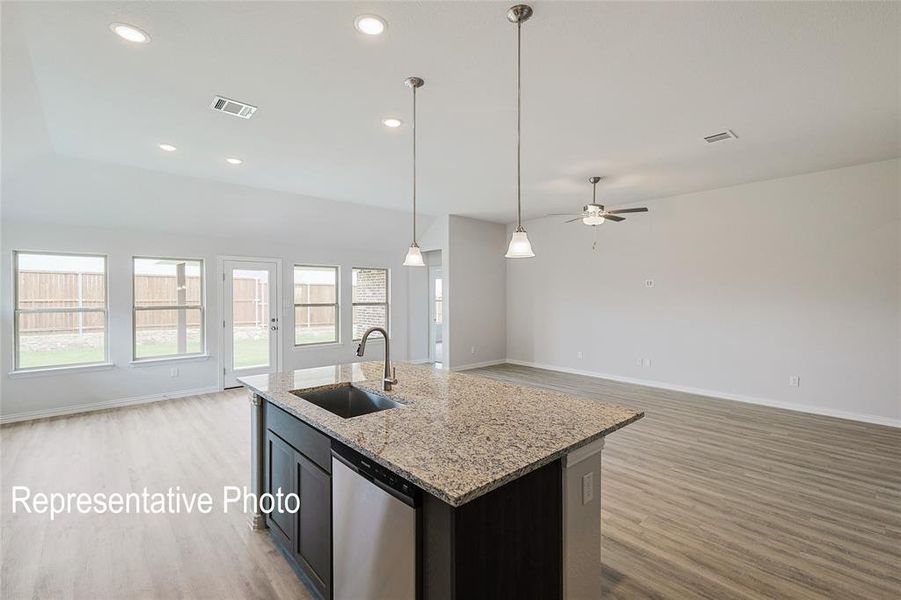 Kitchen with dishwasher, light hardwood / wood-style flooring, sink, a kitchen island with sink, and ceiling fan