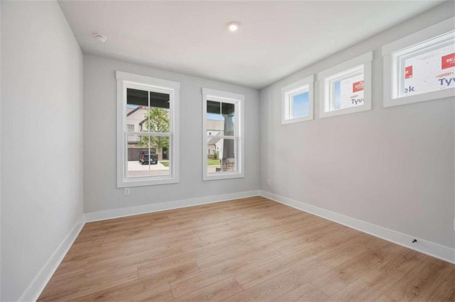 Spacious, unfurnished interior of a new home in The Paddocks at Doc Hughes, Buford (Image 27).