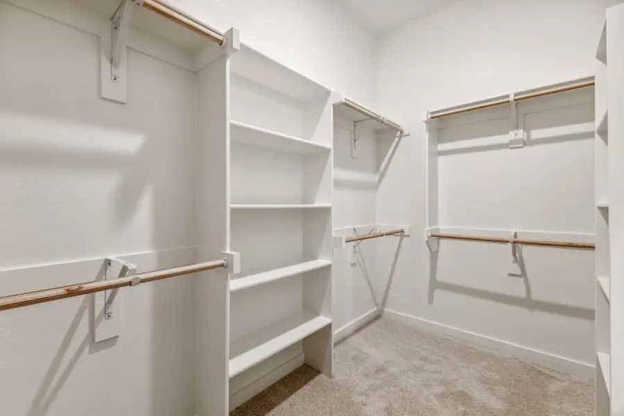 Primary Closet in the Cedar home plan by Trophy Signature Homes – REPRESENTATIVE PHOTO