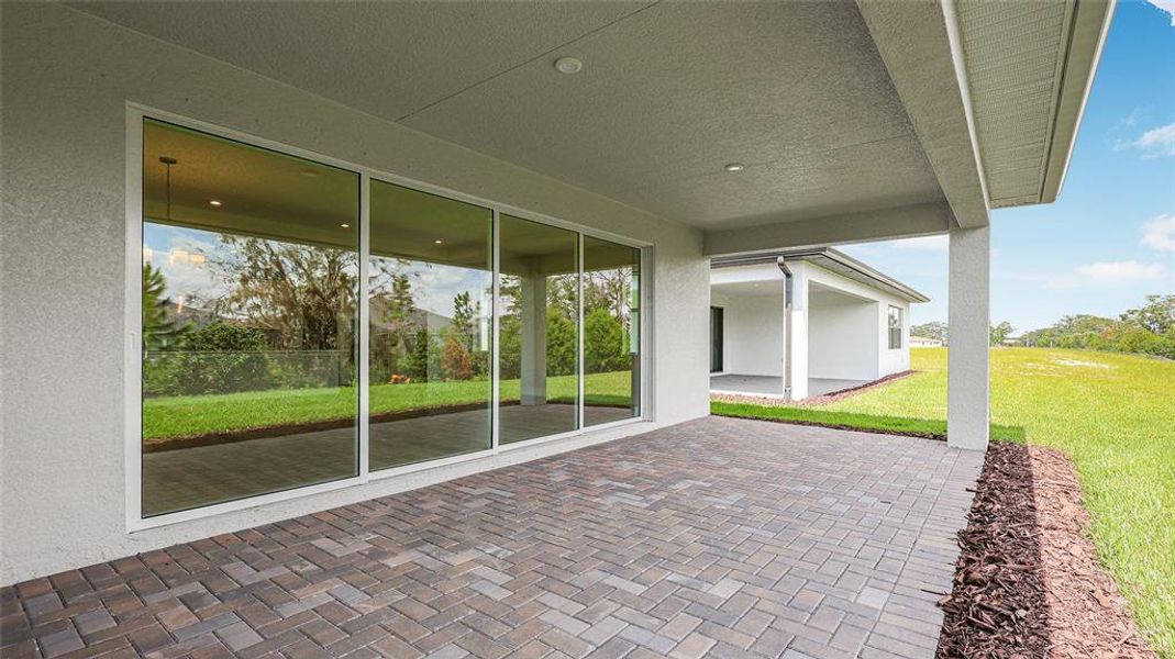 Exterior details and patio area of a home in Woodland Preserve, Parrish (Image 21).