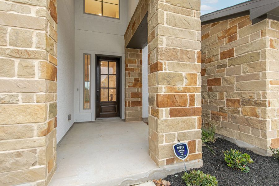 Exterior details and patio area of a home in The Reserve at Potranco Oaks, Castroville (Image 3).