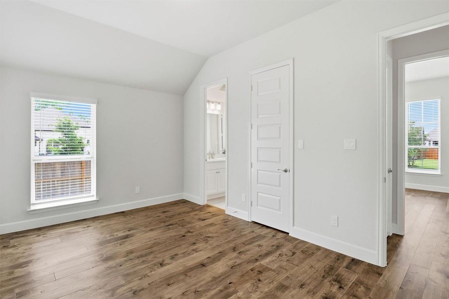 Guest bedroom #2 towards the front of the home with shared adjoining bath. Picture right you can see the layout of the two bedrooms with a shared linen closet outside the two rooms.