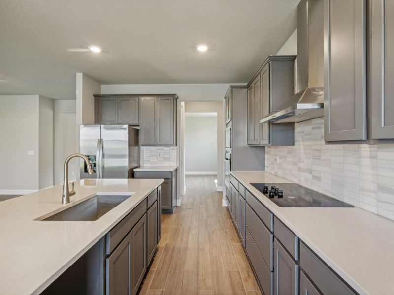 Kitchen in the Onyx floorplan at 6406 NW Sweetwood Drive