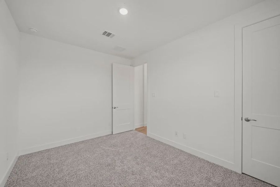 Representative unfurnished interior of a home built from the Mariah by Chesmar Homes in Lakes of Cane Island, Katy (Image 20).