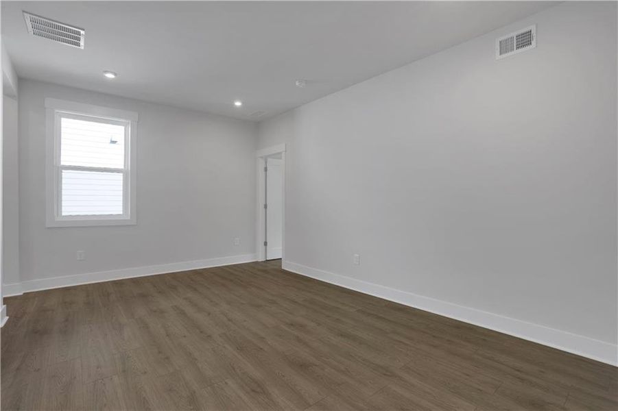 Spacious, unfurnished interior of a new home in The Paddocks at Doc Hughes, Buford (Image 40).