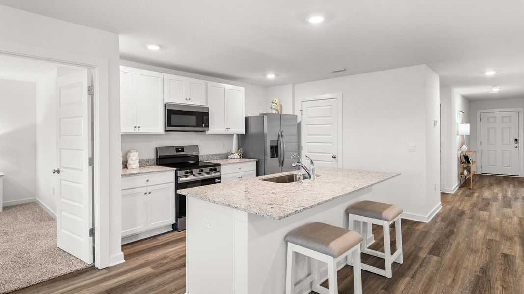 Furnished interior view inside a new home in Magnolia at the Bluffs Phase 3, Freeport (Image 8).