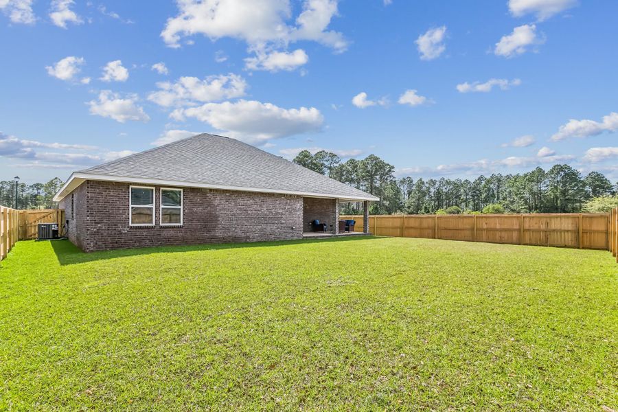 Exterior details and patio area of a home in Buckeyes Landing, Navarre (Image 27).