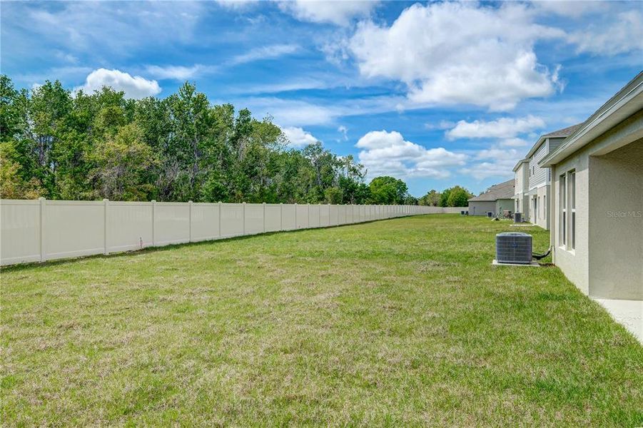 Exterior details and patio area of a home in Crosswind Point, Parrish (Image 19).