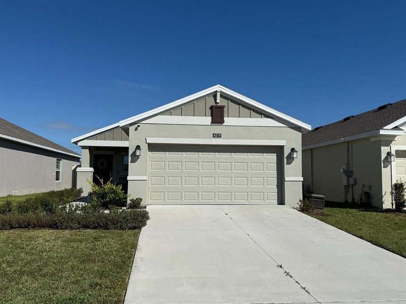 Front exterior of a new home in , Kissimmee, FL, highlighting curb appeal (Image 1).