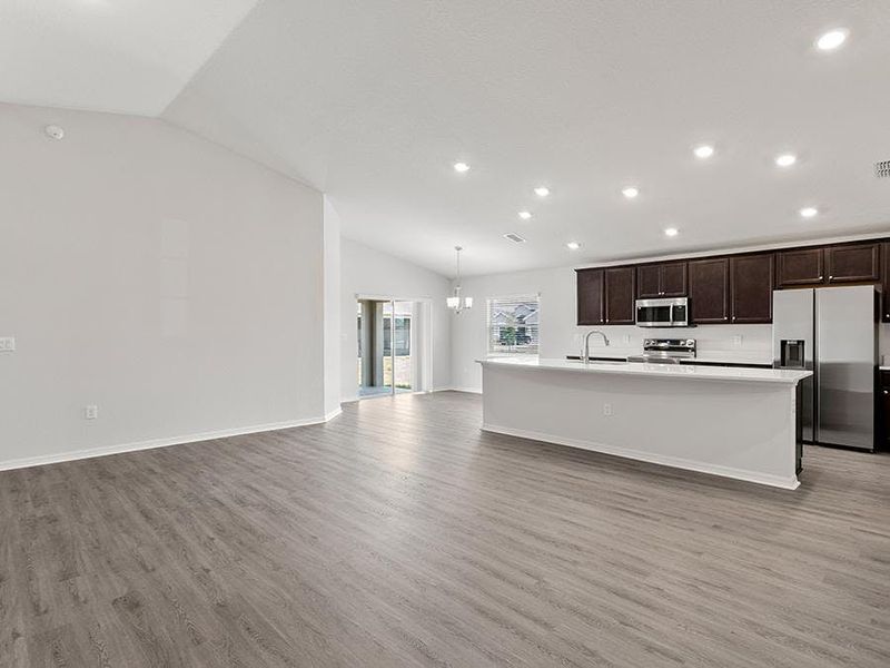 Enjoy a sunny, open living area with volume ceilings - Remy by Highland Homes Enjoy a sunny, open living area with volume ceilings - Remy by Highland Homes