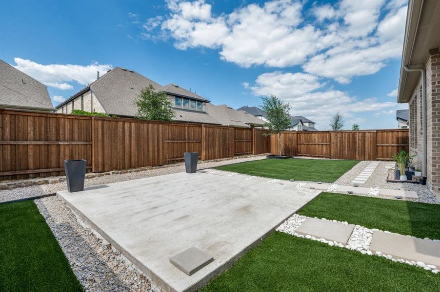 Fenced backyard featuring a patio Fenced backyard featuring a patio