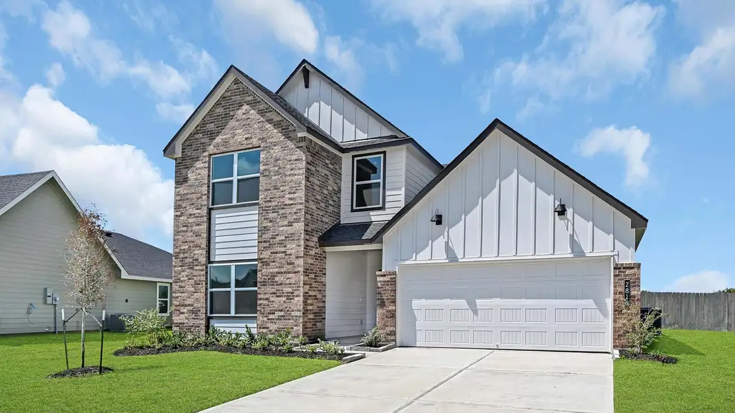 Front exterior of a new home in Holly Ridge, Rosenberg, TX, highlighting curb appeal (Image 2). Front exterior of a new home in Holly Ridge, Rosenberg, TX, highlighting curb appeal (Image 2).