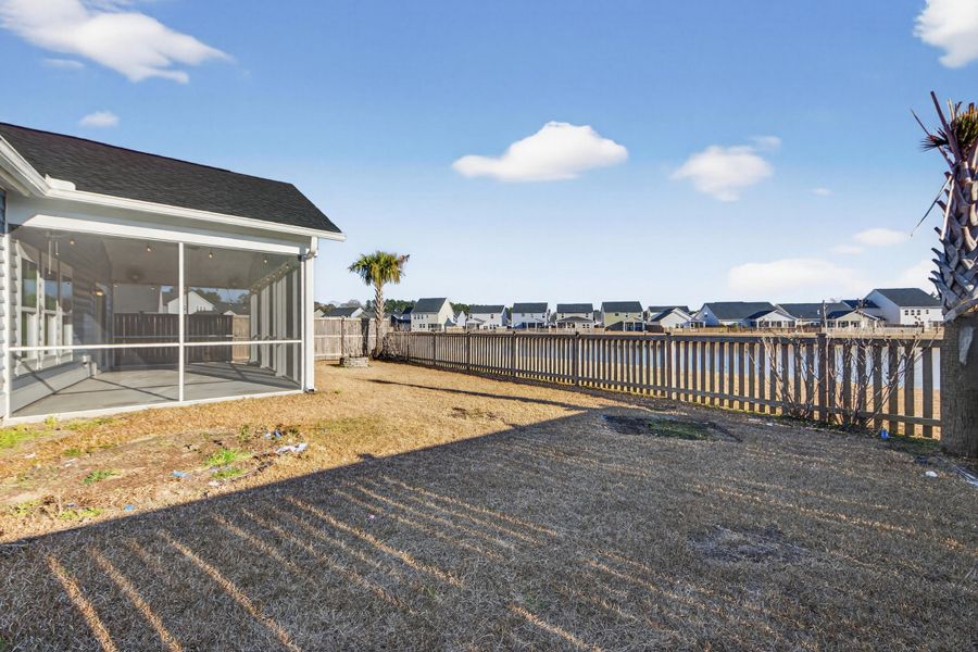 Exterior details and patio area of a home in Azalea Ridge at Summers Corner: Arbor Collection, Summerville (Image 25).