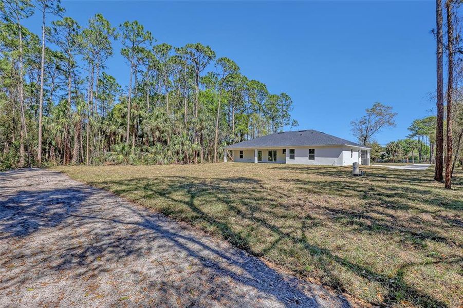 Front exterior of a new home in , Mims, FL, highlighting curb appeal (Image 28).