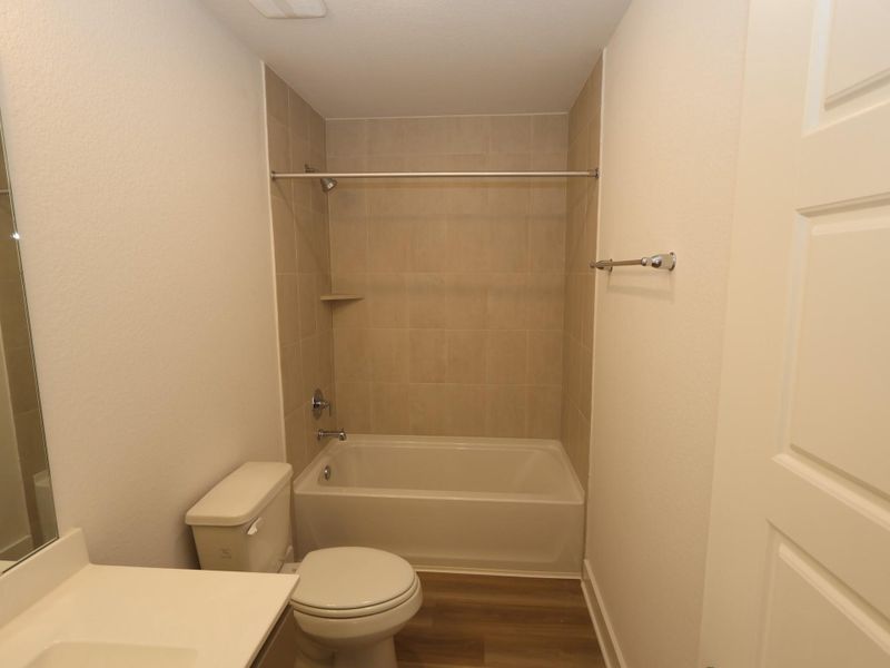 Furnished interior view inside a new home in Lone Star Landing, Montgomery (Image 7).