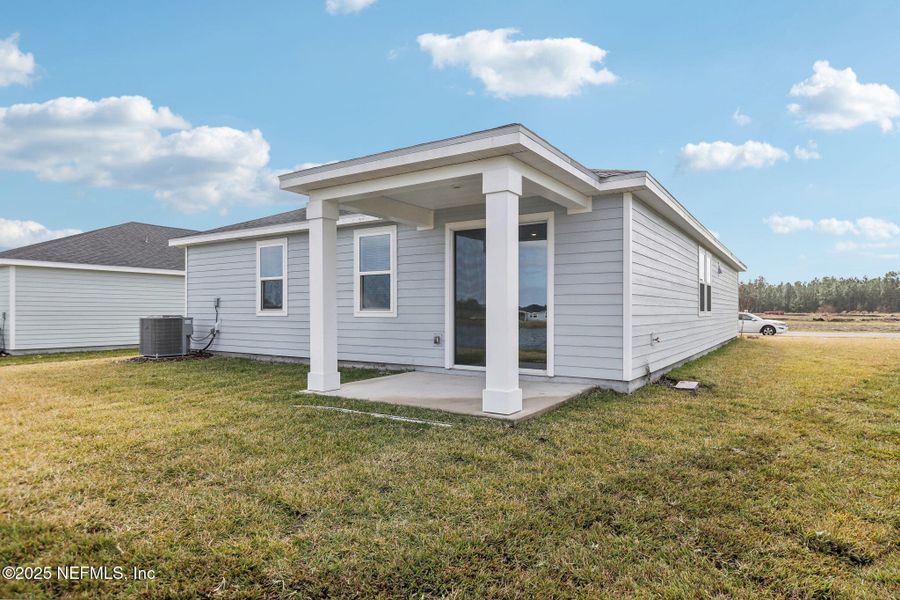 Front exterior of a new home in Lakes at Bella Lago - Signature Series, Green Cove Springs, FL, highlighting curb appeal (Image 18).