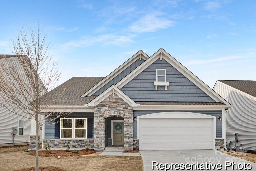 Front exterior of a new home in Whispering Hills, Locust, NC, highlighting curb appeal (Image 18).