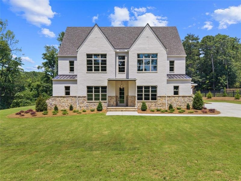 Front exterior of a new home in , Alpharetta, GA, highlighting curb appeal (Image 31). Front exterior of a new home in , Alpharetta, GA, highlighting curb appeal (Image 31).