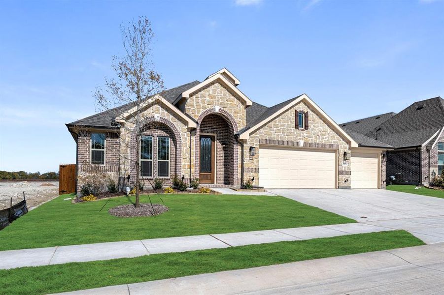 Front exterior of a new home in Meadow Vista 60-65, Anna, TX, highlighting curb appeal (Image 2). Front exterior of a new home in Meadow Vista 60-65, Anna, TX, highlighting curb appeal (Image 2).