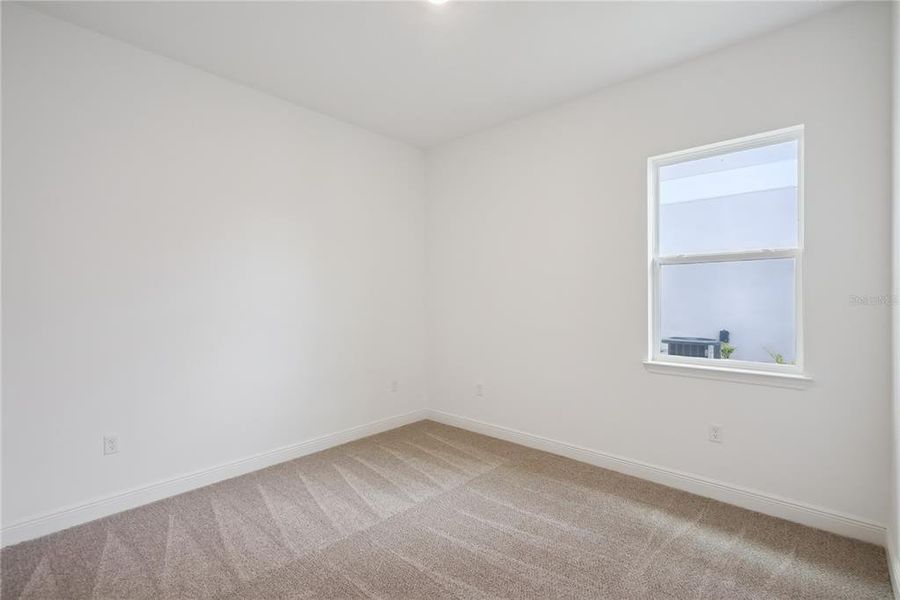Spacious, unfurnished interior of a new home in Laureate Park, Orlando (Image 34).