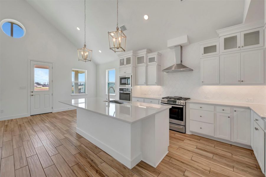 Gourmet island kitchen and sun-lit dining area Gourmet island kitchen and sun-lit dining area