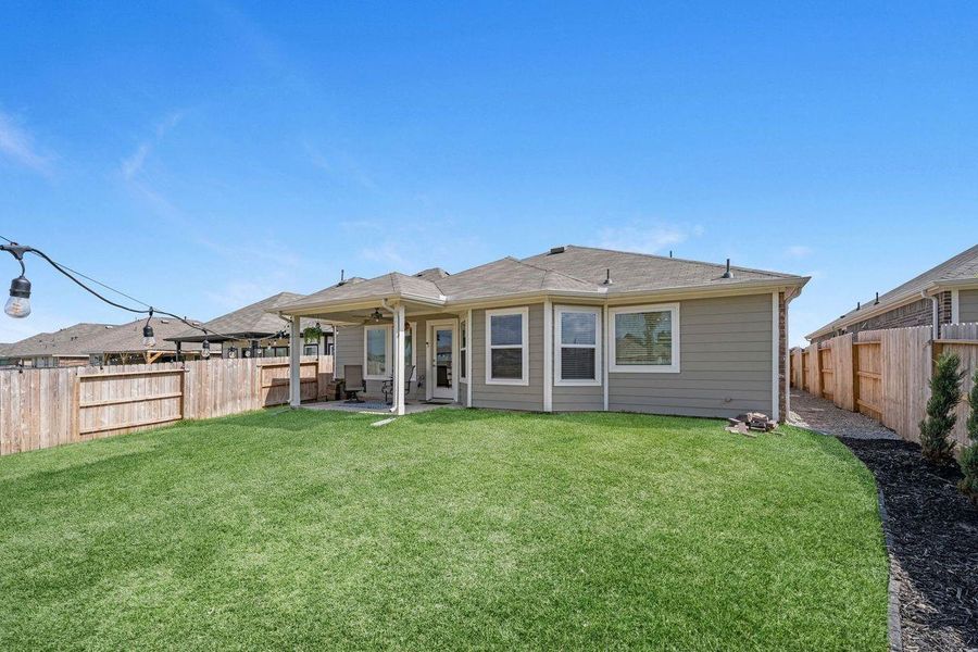 Exterior details and patio area of a home in Magnolia Ridge, Magnolia (Image 3).