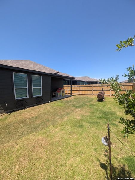 Exterior details and patio area of a home in Rose Valley, Converse (Image 22).