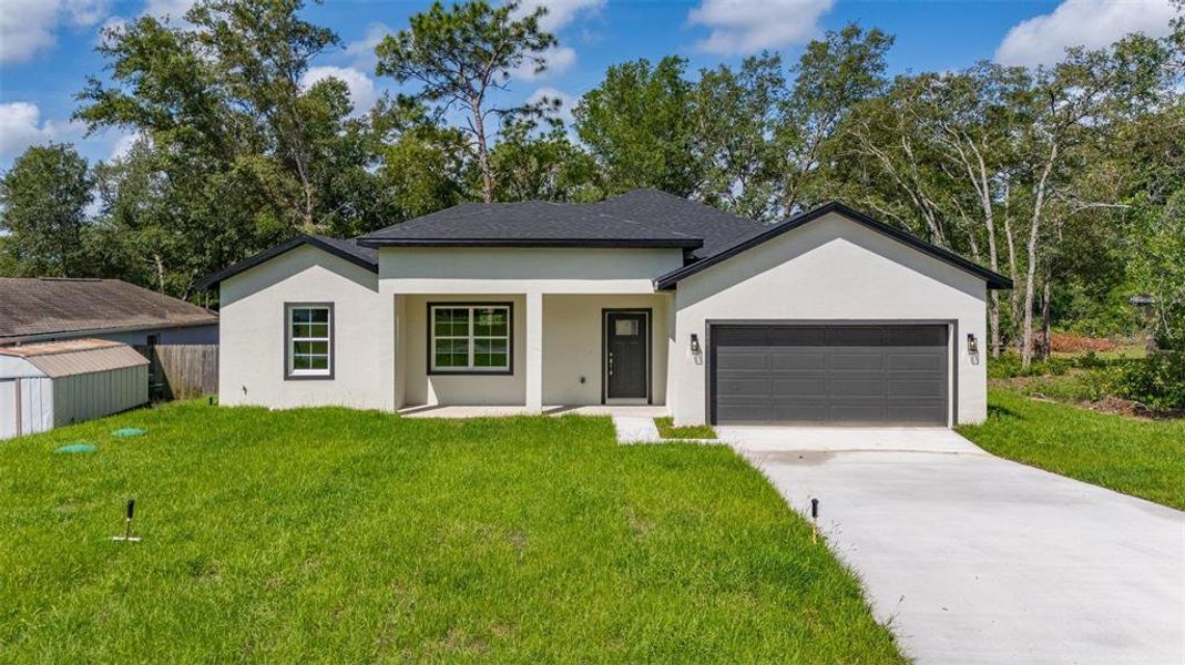 Front exterior of a new home in , Dunnellon, FL, highlighting curb appeal (Image 21).