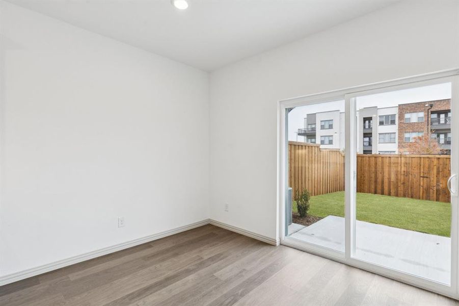 Your new dining room features a sliding glass door that leads out to the patio with fenced back yard!