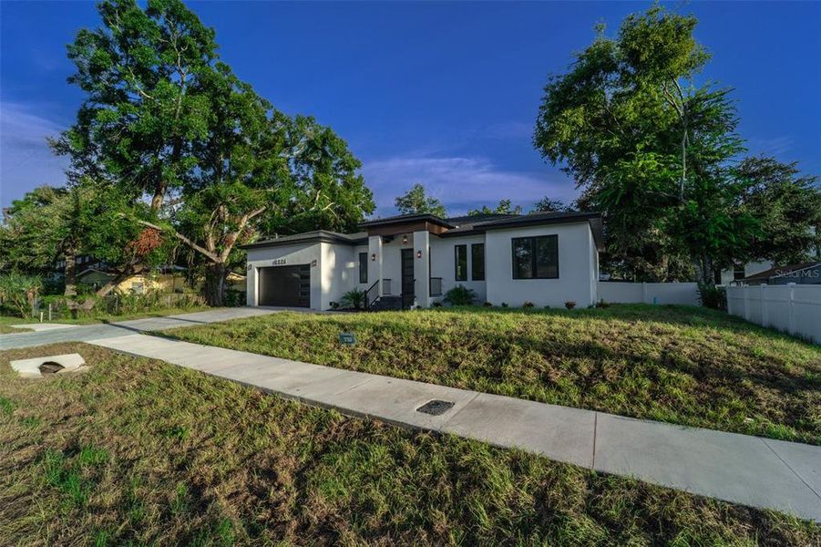 Front exterior of a new home in , Tampa, FL, highlighting curb appeal (Image 25).