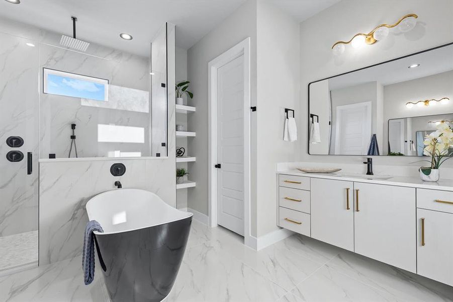 Full bath with a freestanding tub, vanity, a marble finish shower, light marble finish floors, and recessed lighting Full bath with a freestanding tub, vanity, a marble finish shower, light marble finish floors, and recessed lighting