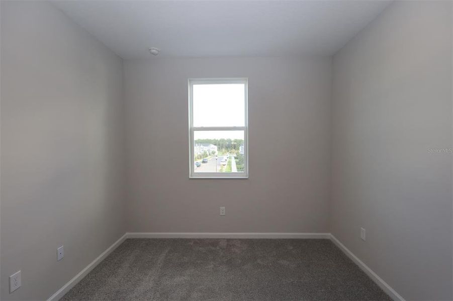 Spacious, unfurnished interior of a new home in Tribute at Ovation, Winter Garden (Image 39).