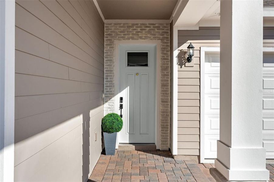 Exterior details and patio area of a home in Weslyn Park at Sunbridge, St. Cloud (Image 32).
