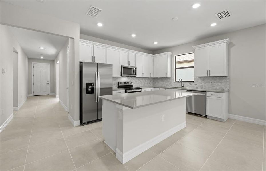 Furnished interior view inside a new home in Cedar Grove at The Woodlands, North Port (Image 9).