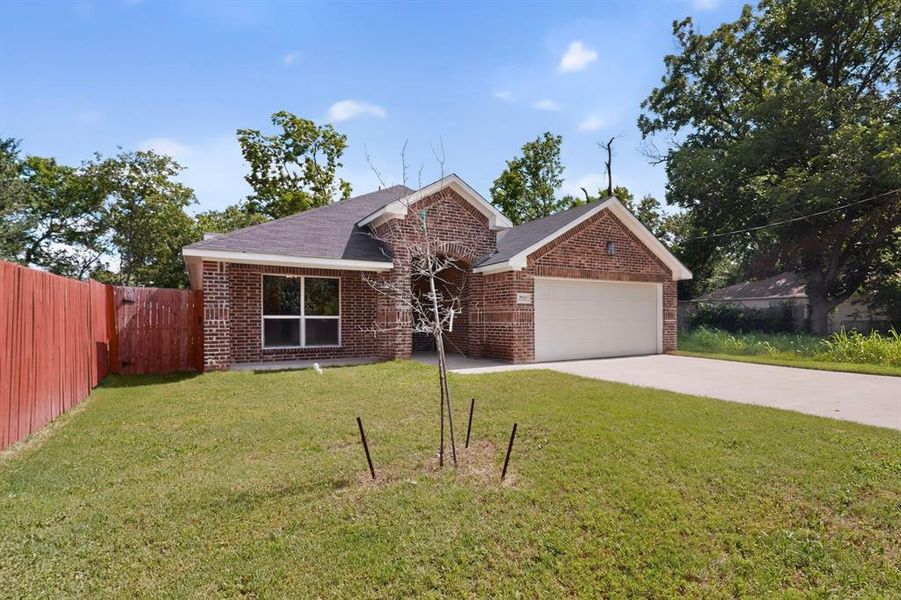 Front exterior of a new home in , Greenville, TX, highlighting curb appeal (Image 21). Front exterior of a new home in , Greenville, TX, highlighting curb appeal (Image 21).