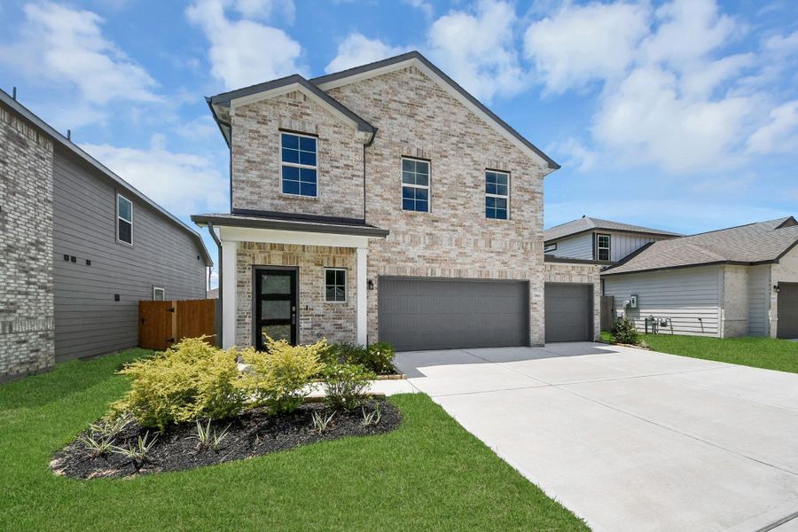 Front exterior of a new home in Hill and Dale Ranch, Splendora, TX, highlighting curb appeal (Image 18).