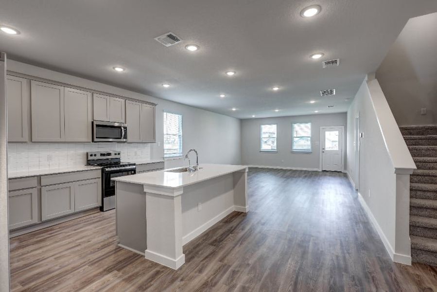 A kitchen with white cabinets. A kitchen with white cabinets.
