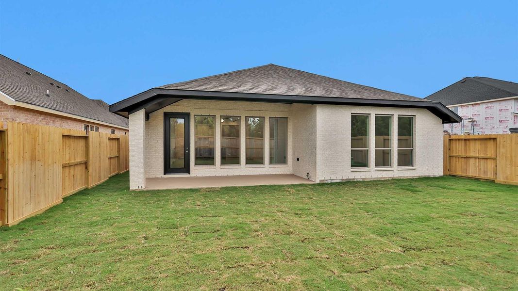 Front exterior of a new home in Candela South 50', Richmond, TX, highlighting curb appeal (Image 8).