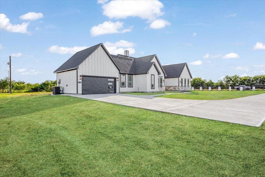 Alternate front elevation highlighting the oversized lot and impressive curb appeal. Alternate front elevation highlighting the oversized lot and impressive curb appeal.