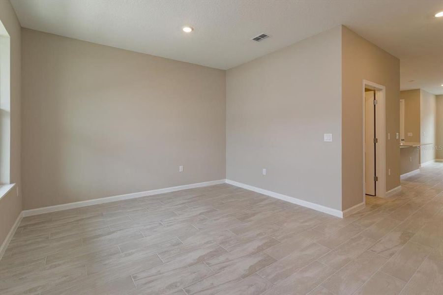 Spacious, unfurnished interior of a new home in Serenade at Ovation, Winter Garden (Image 17).
